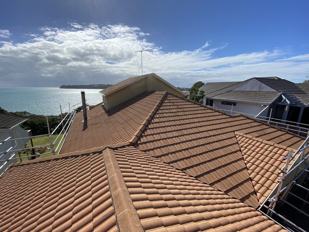 Faded concrete tile roof before Goliath Coatings restoration — Auckland